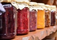 multiple jam jars with different colour produce and cloth lids