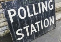 'polling station' written in white on a blackboard